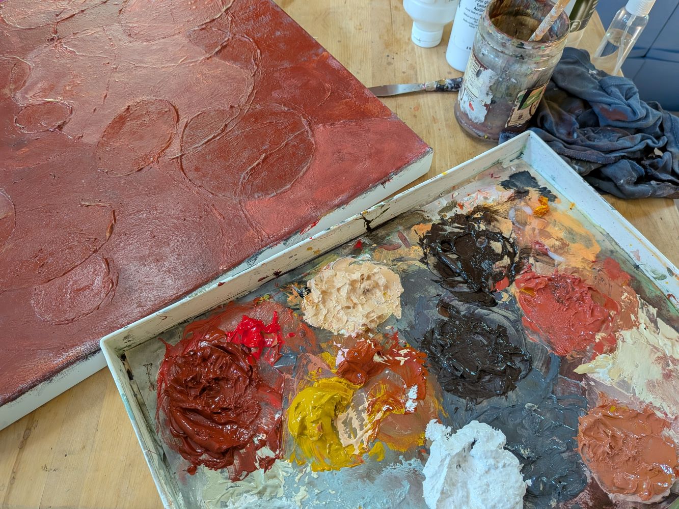 At work in Lee Ann Thill's art stdio Paint palette and work in progress in Lee Ann Thill's art studio